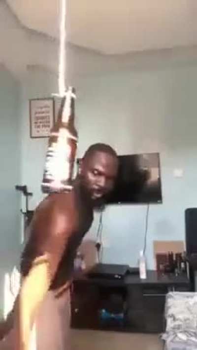 Man cuts himself while showing how to "smash a bear bottle with a knife in style"
