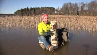 Man hits log on ice and instantly regrets it
