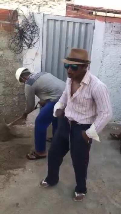 Brazilians construction workers having a little fun while tributing Queen